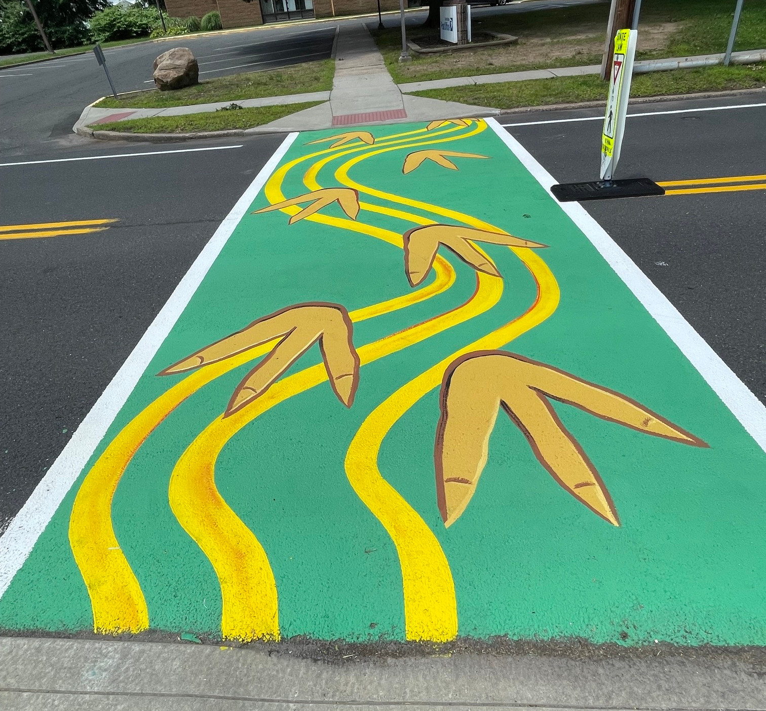 KRS Art Studio also painted a dinosaur track mural on this Church Street crosswalk between the Rocky Hill Library and the post office.