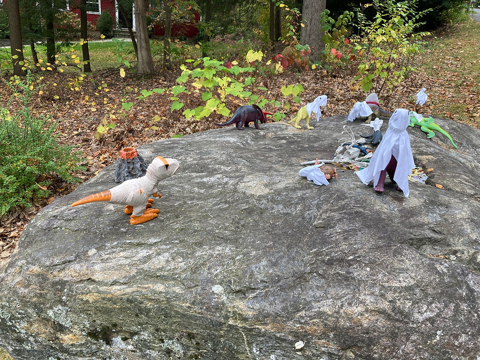 On Rex Rock, the dinosaurs don mummy and ghost costumes for Halloween.