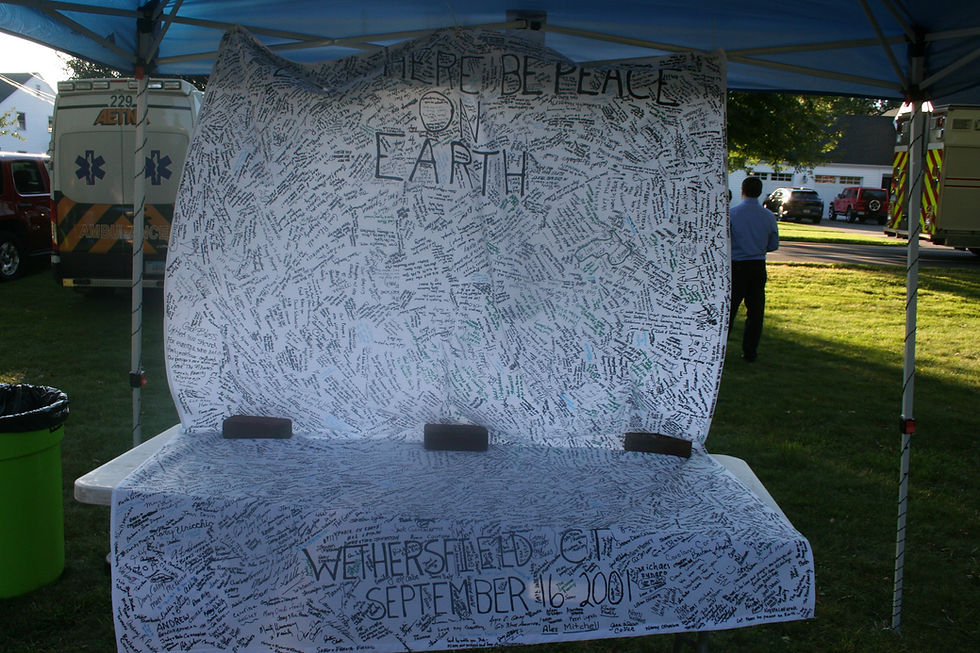 A large banner that was signed by many of those who attended a candlelight vigil on the Broad Street Green five days after the Sept. 11, 2001, terrorist attack was displayed at this year’s event.