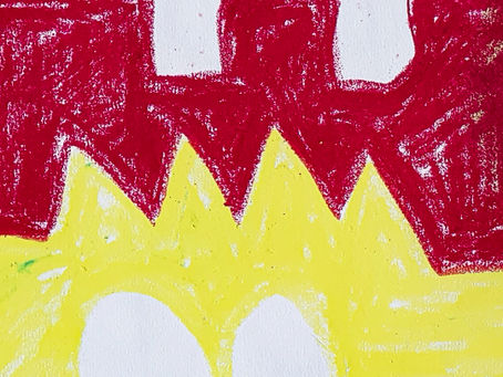 Four bright colours, of blue, yellow, red and magenta, with white feet hanging out of the bed.