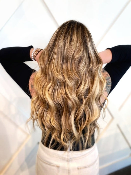Woman with long, wavy blonde hair