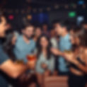 A party with young adults enjoying cocktails.