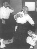 Grandmaster Morihei Ueshiba Behind Him ,master Tsuda