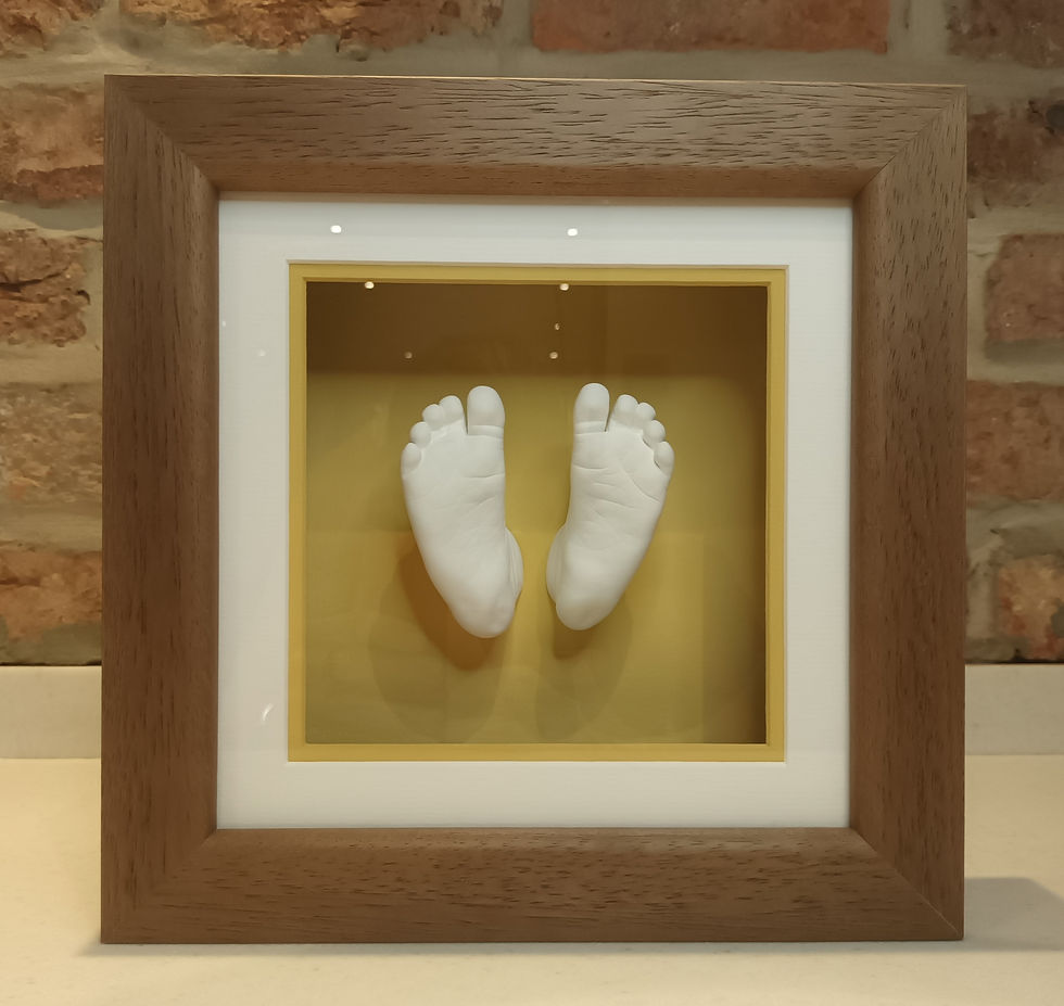 Framed stone baby feet in oak frame