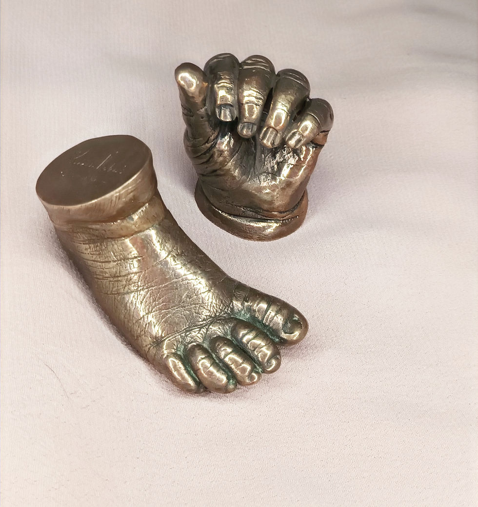 Bronze baby hand and foot cast sculpture, handcrafted keepsake capturing newborn detail and emotional significance.