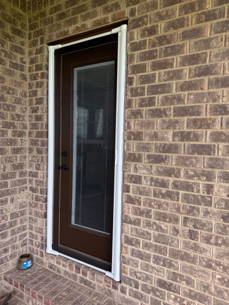 Retractable screen door installed on a back entry door in Bowling Green, KY with the screen retracted and hidden from view.