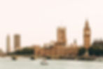 boat on river with buildings in background