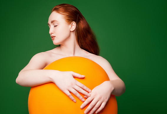 Girl Hugging Orange Ball