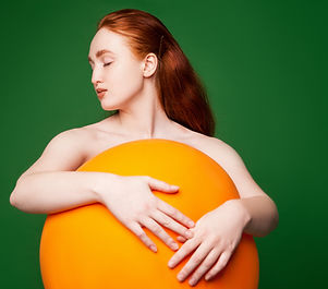 Girl Hugging Orange Ball