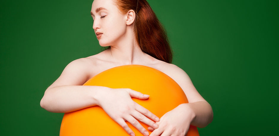 Girl Hugging Orange Ball