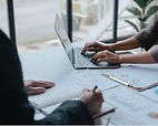 Professional reviewing financial data for strategic asset management and investor returns