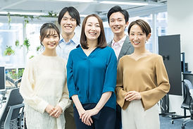 Japanese men and women looking at the camera with a smile.jpg