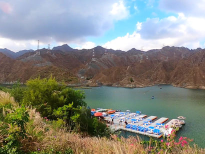 Alkhor Kayak at Al Rafisah Dam in Khor Fakkan UAE with mountain views and kayaks on the lake