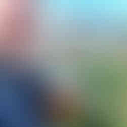 Sports travel Tom drinking a beer at Bar Marcelino in Barcelona, football pitch and city in background.