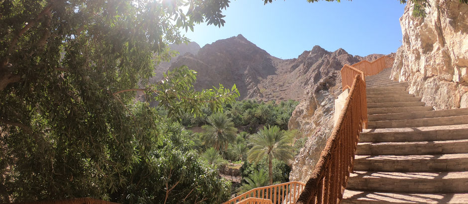 Wadi Shees Nature Trail staircase with oasis and mountains in Sharjah UAE
