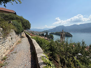 Stone walking path overlooking Isola Comacina and the mountains on Lake Como