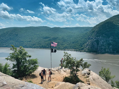 Breakneck Ridge viewpoint with American flag overlooking the Hudson River near Cold Spring New York