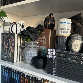 A bookshelf with halloween decor