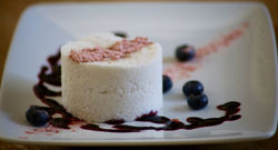 coconut cake.berry coulis.