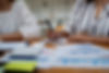 close-up-business-woman-taking-note-group-of-busi-2023-11-27-04-57-46-utc.jpg