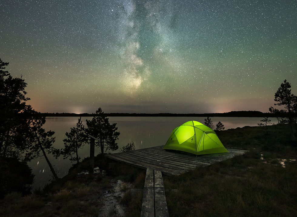 Tent under the Milky Way and starry night