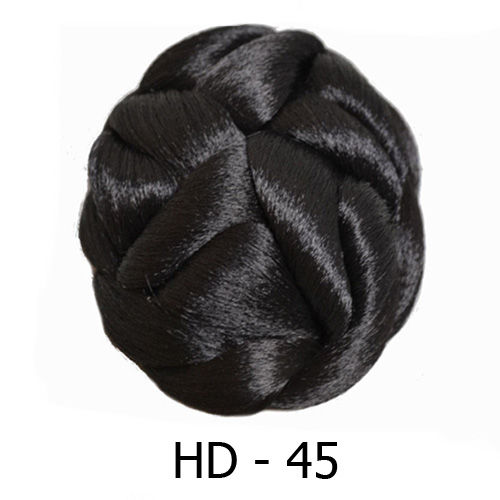 Dark brown hair dome with thick asymmetrical braid details all around.