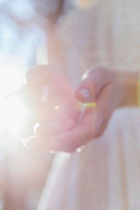 4. woman-holding-her-hands-sunlight copy.jpg
