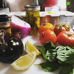 Fresh tomatoes, basil, onion, lemon, and cooking oils