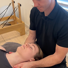 Billy Gilhooley providing hands-on physiotherapy treatment at his Preston clinic
