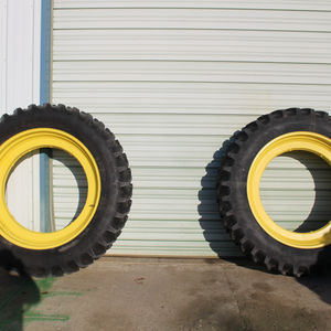 Firestone 14.9R46 Tires on 38" Step up Beveled Rims