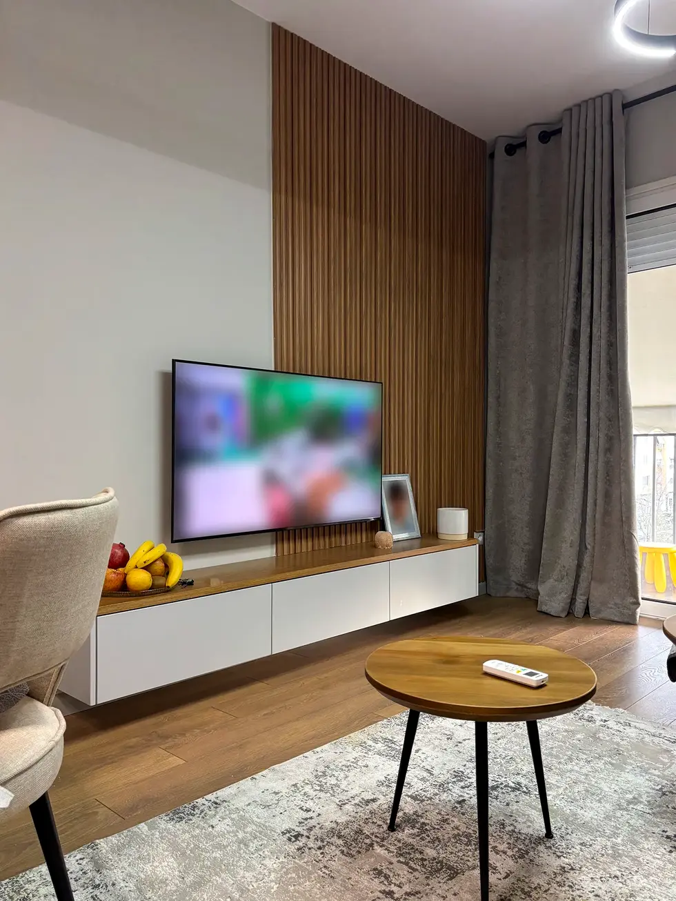 custom living room furniture including TV wall unit by Nuho Atelierbespoke living room cabinetry and shelving designed by Nuh