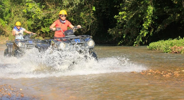 ATV quad tour Punta Cana - riding through a river crossing