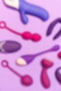 Several sex toys on a purple background