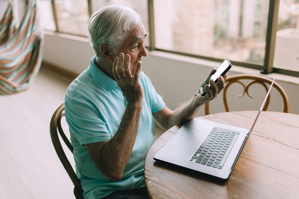 Senior with Mobile Phone and Laptop