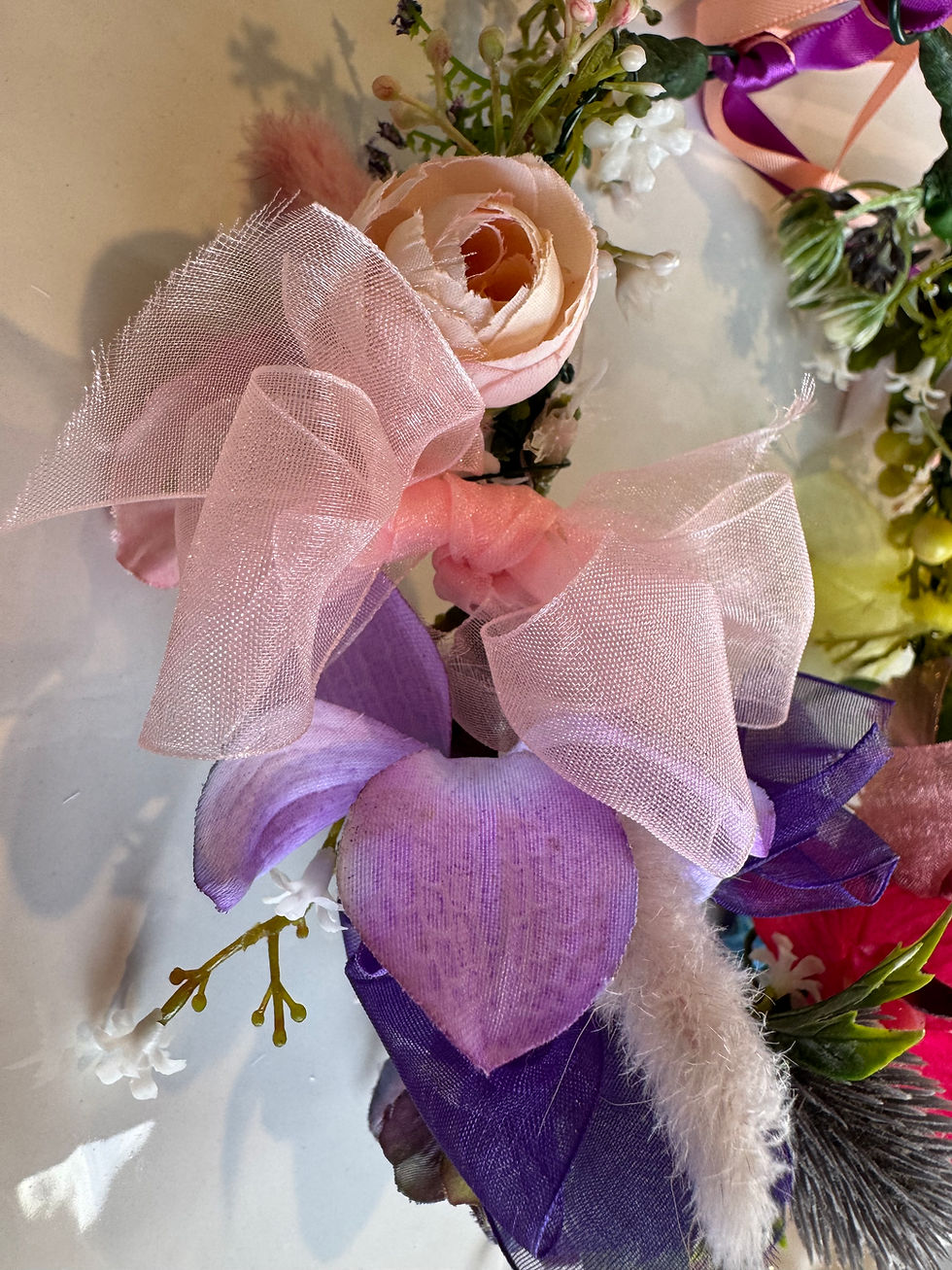 Thumbnail: Close shot of JW Weddings floral headband with rose, onion flower, bunny tail, and organza ribbon