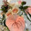 Thumbnail: Closeup shot of waterfall bouquet focusing on real touch anthurium head and soft pink roses, with green leaves