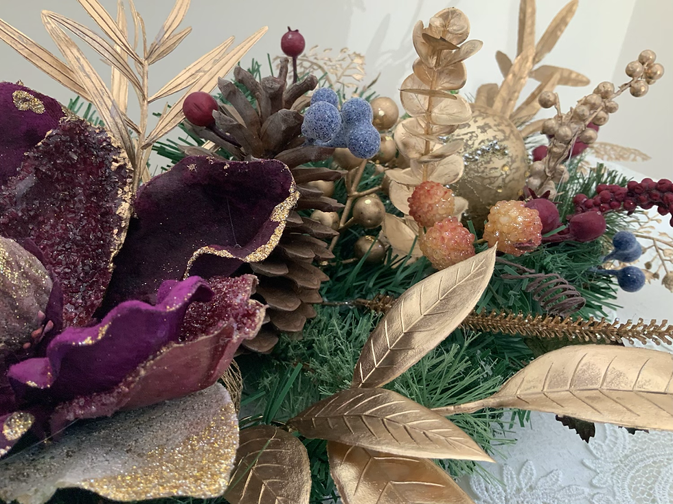 Thumbnail: Sparkling luxe Christmas centrepiece with gold baubles, holly berry, gold accents, and stunning festive magnolia flower