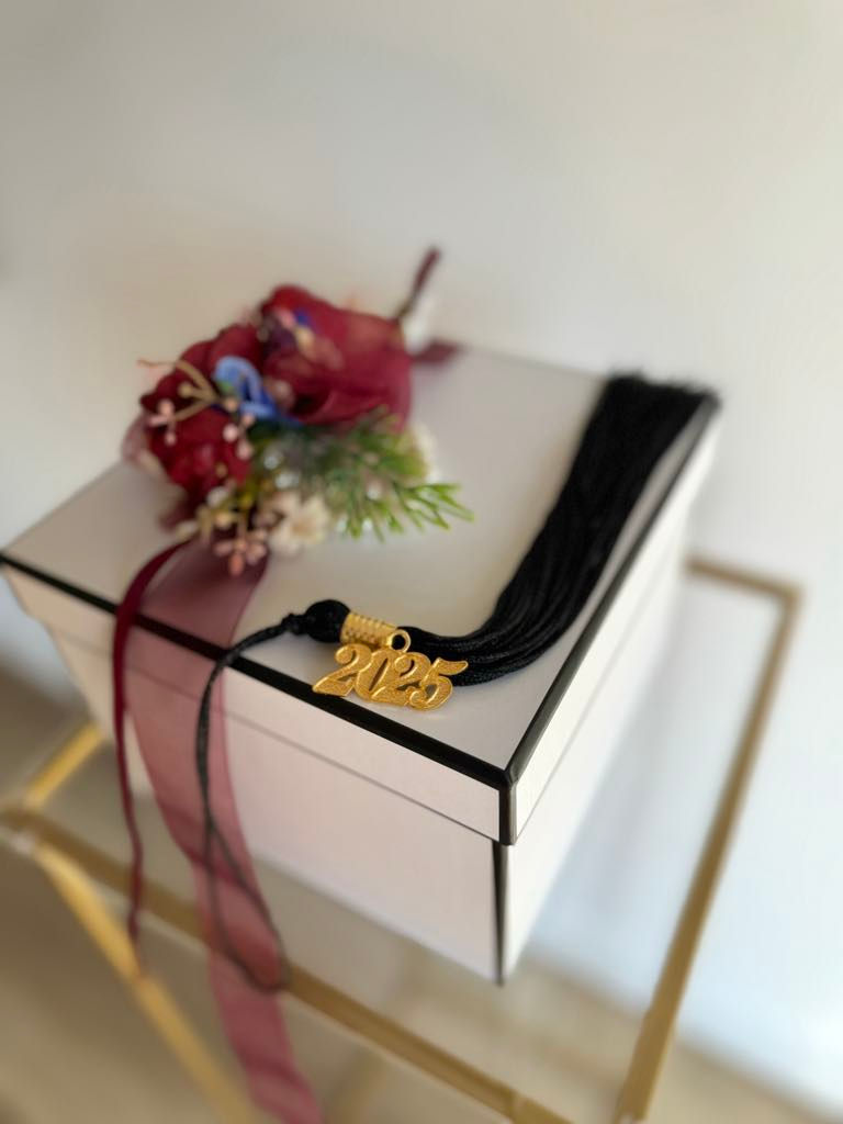 Thumbnail: Graduation gift box - graduate faux flower corsage on white gift box with 2025 graduate charm with tassel