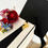 Thumbnail: Graduation gift box - graduate faux flower corsage on white gift box with 2025 graduate charm with tassel