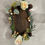 Thumbnail: Mini rectangular advent candle Christmas stand with roses, acorn, green foliage