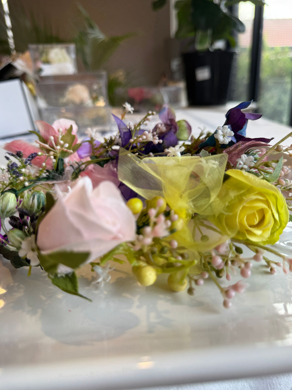 Thumbnail: Close shot of JW Weddings floral headband with rose, onion flower, bunny tail, and organza ribbon