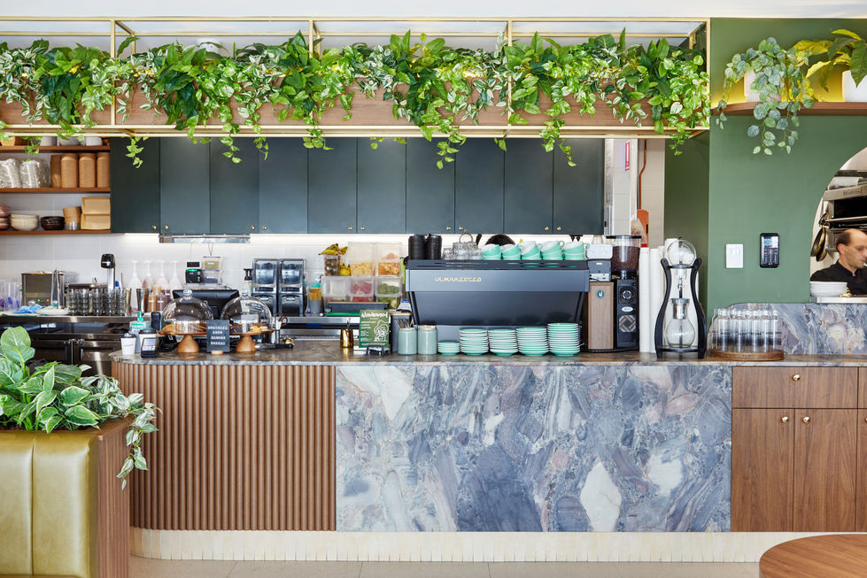 a la marzocco coffee machine sits behind a counter