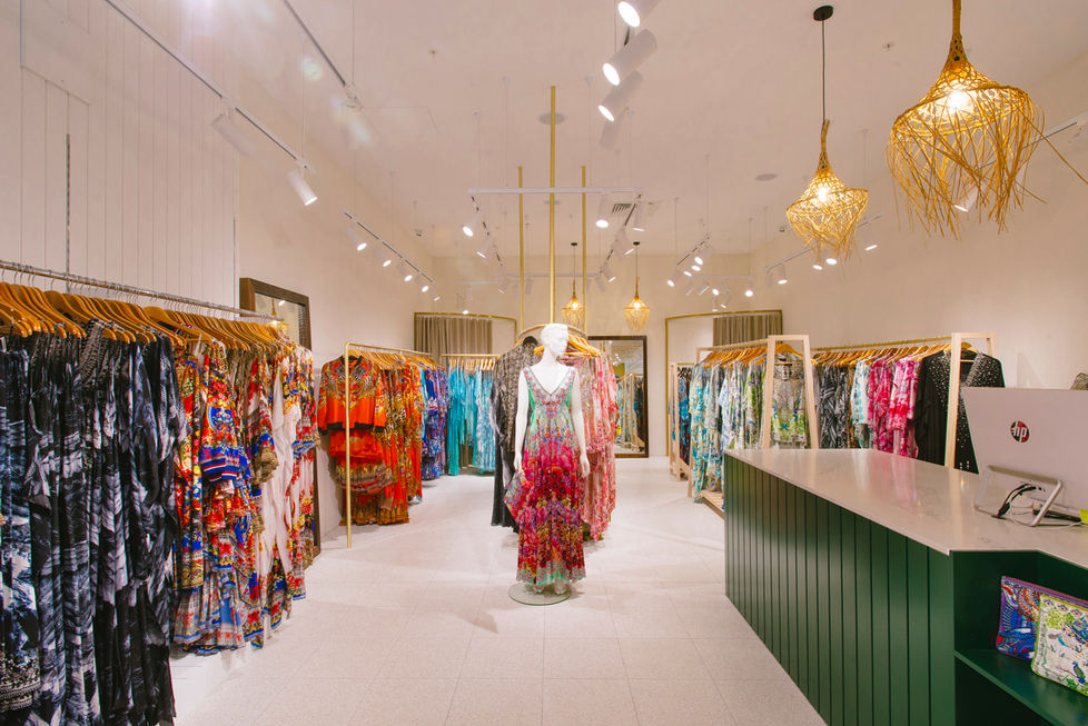 a store filled with lots of clothes and a mannequin