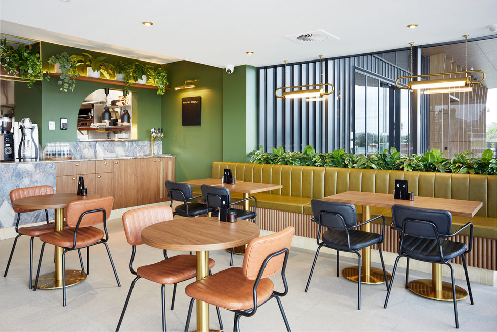 a restaurant with tables and chairs and a sign on the wall that says ' dinner steak '