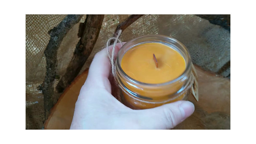 rustic pure soy candle in squatty 4 ounce mason jar with a metal screw top and engraved wooden tag tied to jar with twine.
