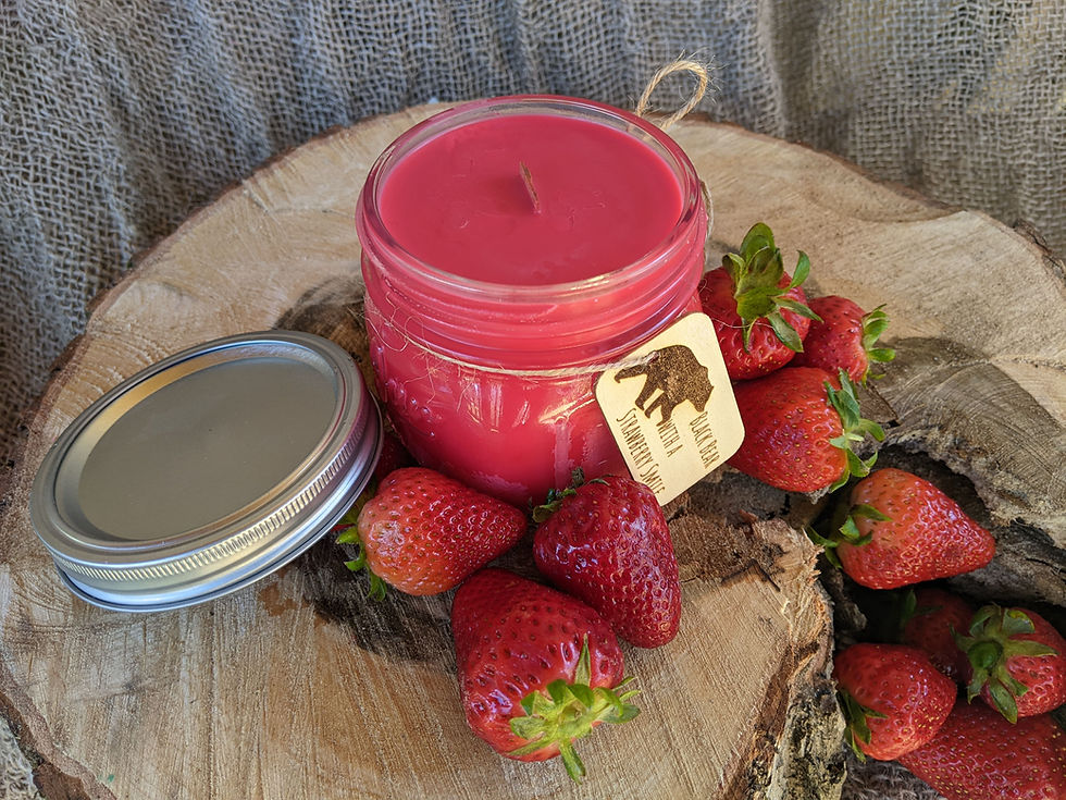 Thumbnail: squatty 12 ounce mason jar soy candle with wood wick and wooden engraved tag tied on with twine.