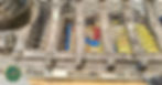 View of the back of of a Jeep 7 slot grille laying on a table with panel retaining grips in view.