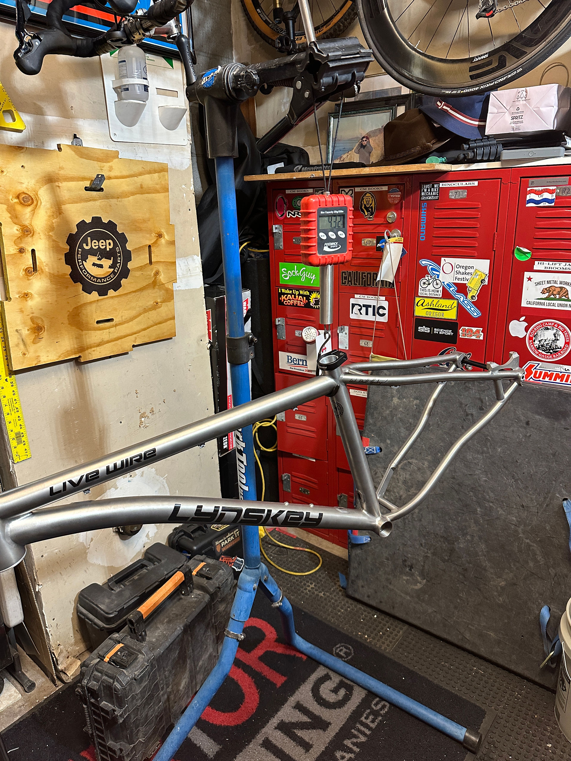 Lynskey Live Wire 4.32 LBS my lynskey live wire frame hanging from a suitcase scale that is hanging on my Park Tool Bike repair stand. The frame weighed 4.32 lbs. Weight is important on a bike.