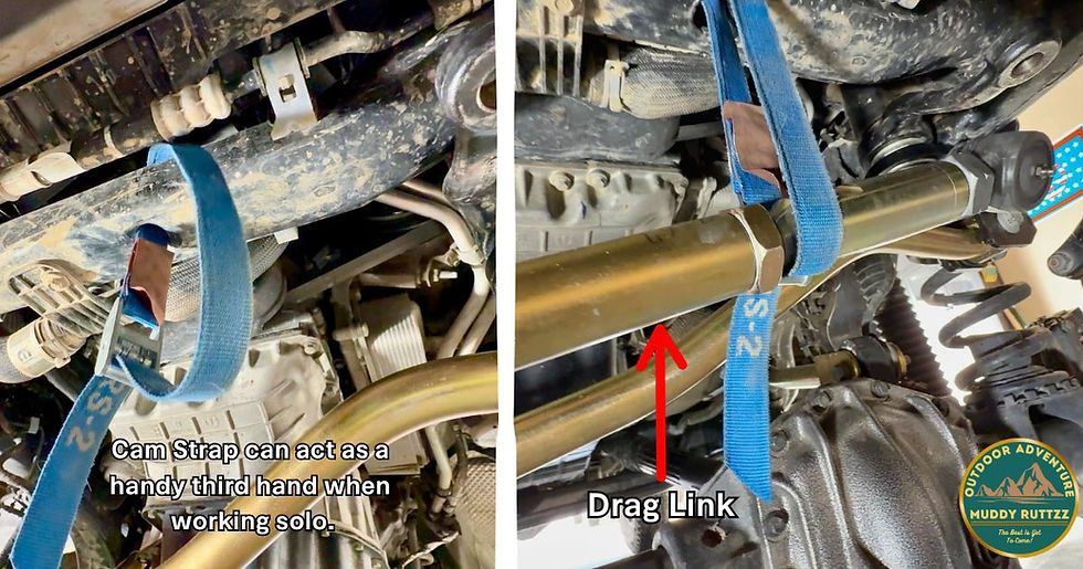 Blue cam strap holds car parts under a vehicle. Text reads: "Cam Strap can act as a handy third hand when working solo" and "Drag Link." Logo in corner.
