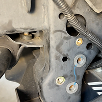 Rivnuts installed on Gladiator frame to hold Bilstein reservoir DIY lift kit install